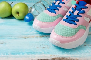 pink-sport-shoes-bottle-of-water-and-green-apples-2022-12-11-23-59-34-utc